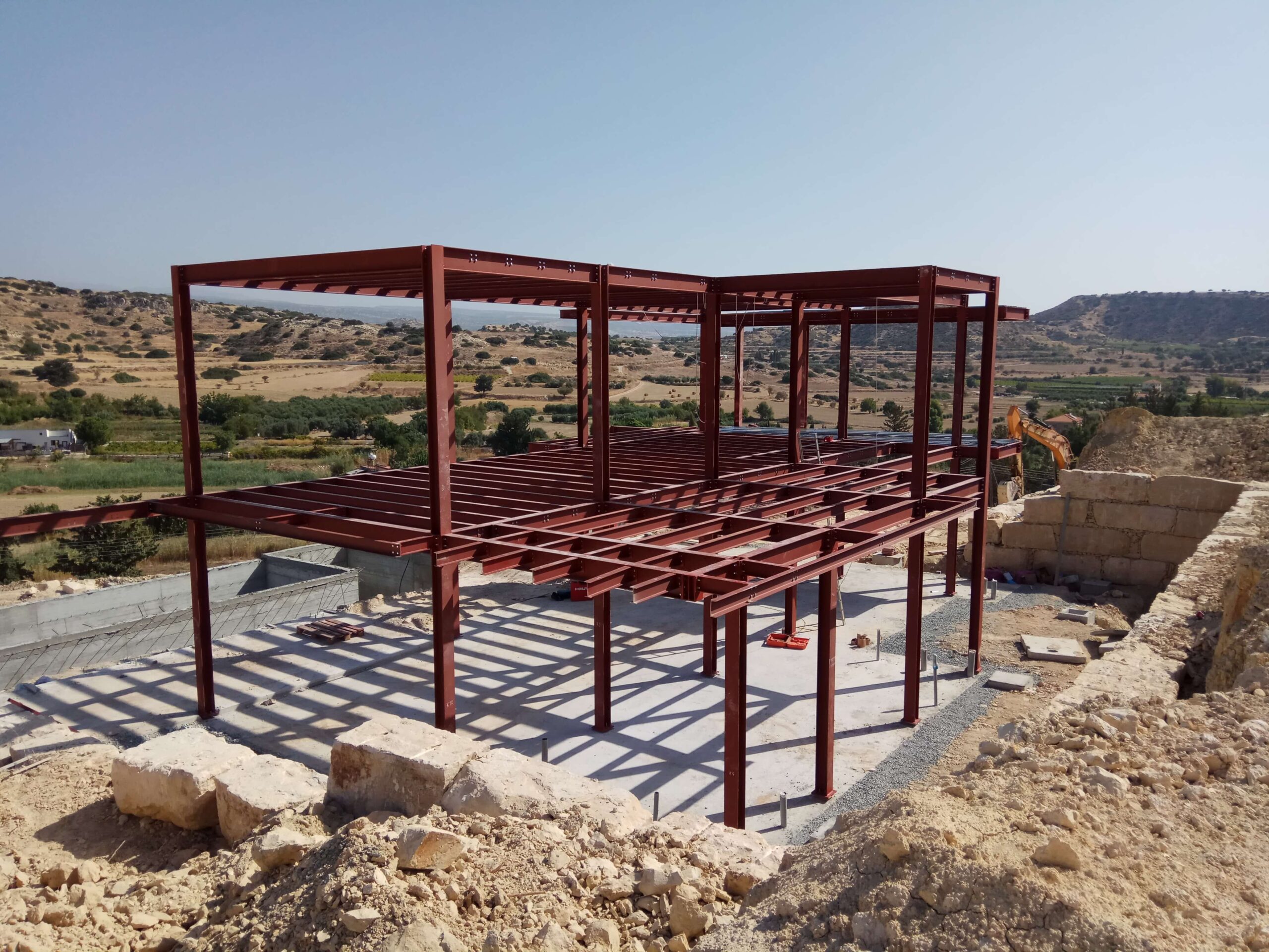 Steel structure of the Pissouri residence above the Cyprus countryside