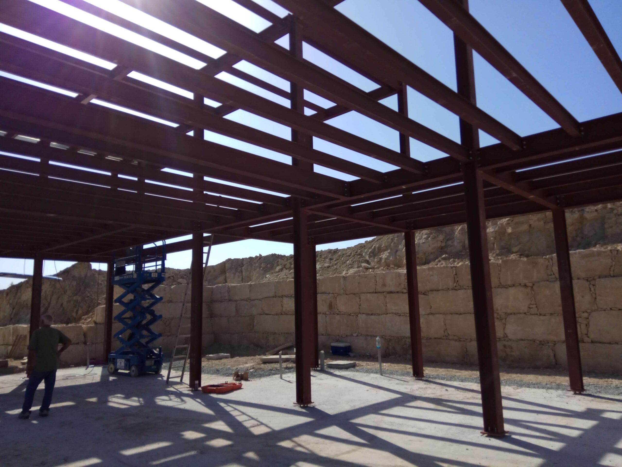 View through the steel frame of the Pissouri residence during assembly